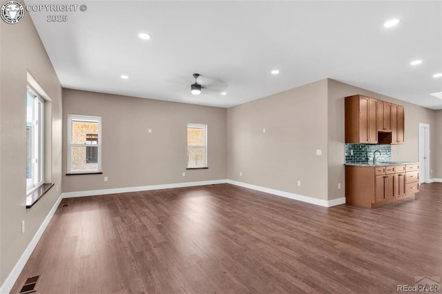 3010 Grandview Ave, Canon City, CO 81212 - unfurnished living room featuring a ceiling fan, healthy amount of natural light, dark wood-type flooring, and recessed lighting