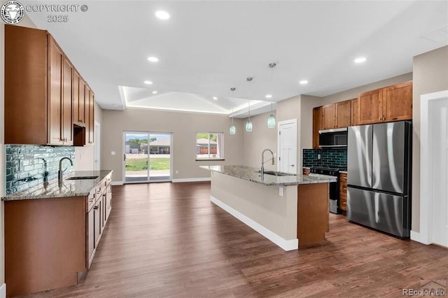 3010 Grandview Ave, Canon City, CO 81212 - kitchen featuring a raised ceiling, stainless steel appliances, dark wood-style flooring, recessed lighting, and decorative backsplash