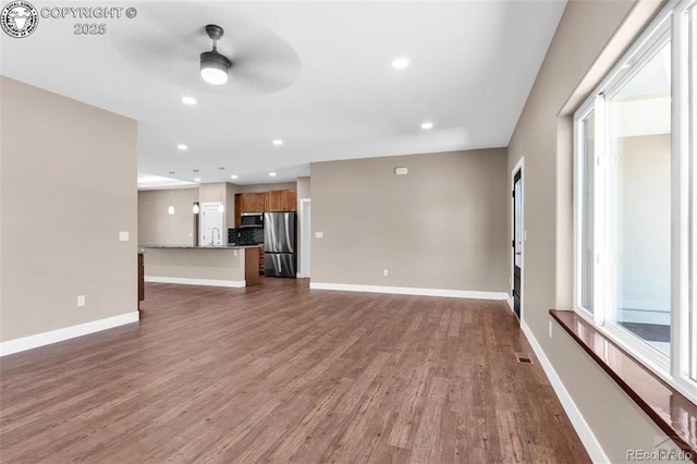 3010 Grandview Ave, Canon City, CO 81212 - unfurnished living room with a ceiling fan, dark wood-type flooring, and recessed lighting