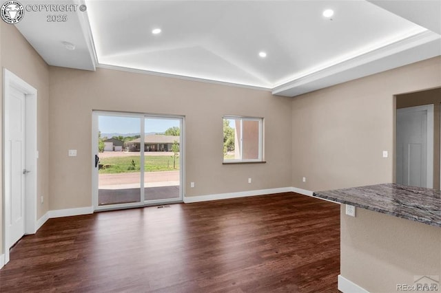 3010 Grandview Ave, Canon City, CO 81212 - unfurnished living room with dark wood-type flooring, recessed lighting, vaulted ceiling, and a tray ceiling