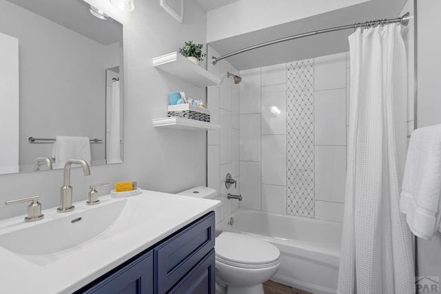 3666 Iguana Dr, Colorado Springs, CO 80910 - full bath featuring shower / bath combo with shower curtain, toilet, and vanity