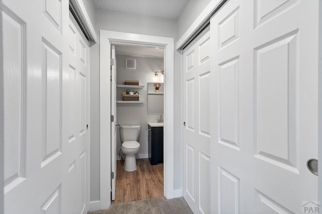 3666 Iguana Dr, Colorado Springs, CO 80910 - bathroom with toilet, vanity, and baseboards