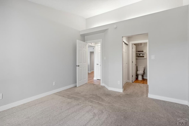 3666 Iguana Dr, Colorado Springs, CO 80910 - unfurnished bedroom featuring light colored carpet, baseboards, and ensuite bathroom