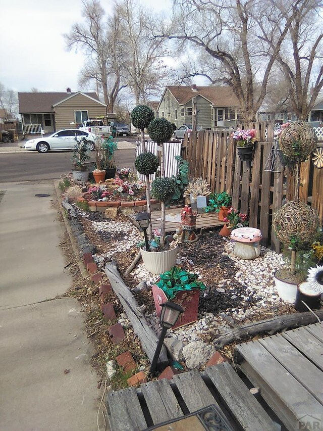 view of yard featuring a residential view and fence