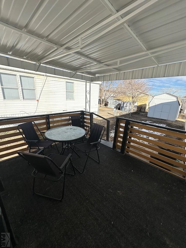 view of patio featuring an outbuilding and a storage shed