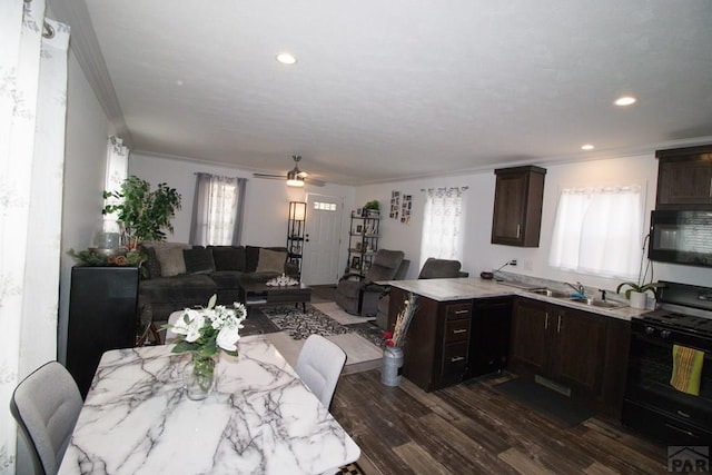 218 W Thurlow Ave, Cripple Creek, CO 80813 - dining space featuring crown molding, dark wood-style flooring, ceiling fan, and recessed lighting