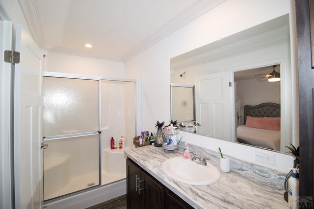 218 W Thurlow Ave, Cripple Creek, CO 80813 - ensuite bathroom with vanity, a stall shower, ornamental molding, ceiling fan, and recessed lighting