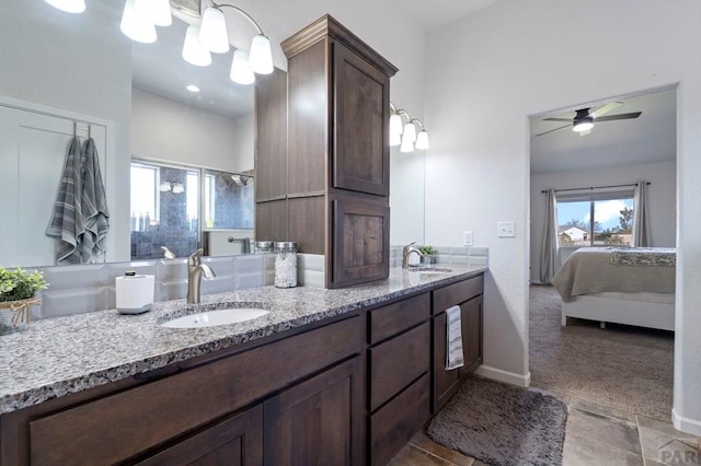 bathroom with an enclosed shower, tile patterned flooring, double vanity, and a sink