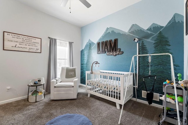 carpeted bedroom featuring a ceiling fan, a nursery area, and baseboards