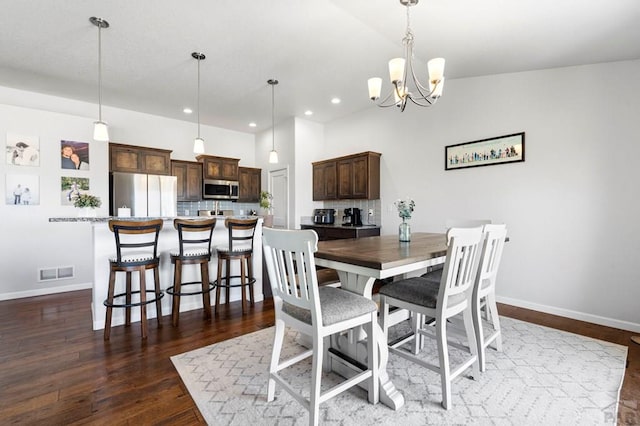 dining area featuring recessed lighting, an inviting chandelier, dark wood-style flooring, visible vents, and baseboards