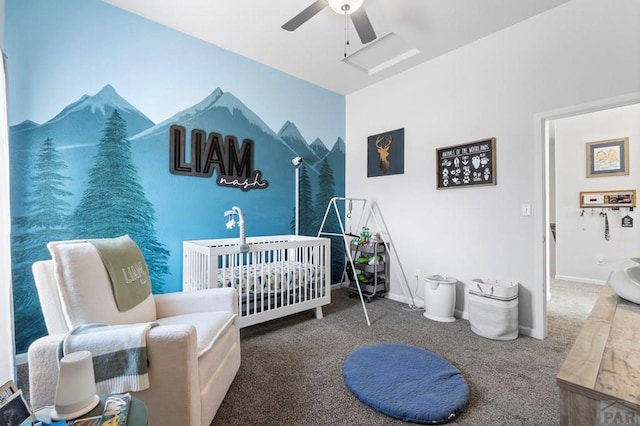 bedroom with a ceiling fan, carpet flooring, baseboards, and a crib
