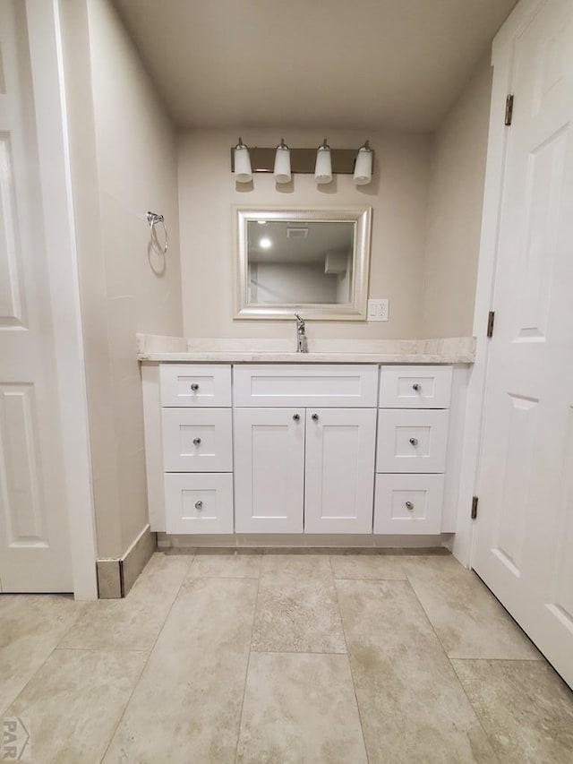 bathroom featuring vanity and baseboards