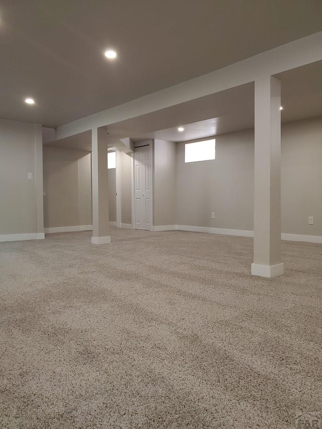 below grade area featuring recessed lighting and baseboards