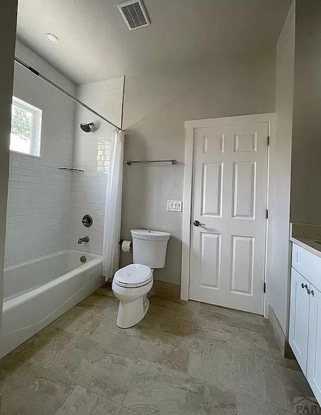 full bath with visible vents, vanity, toilet, and shower / bath combo with shower curtain