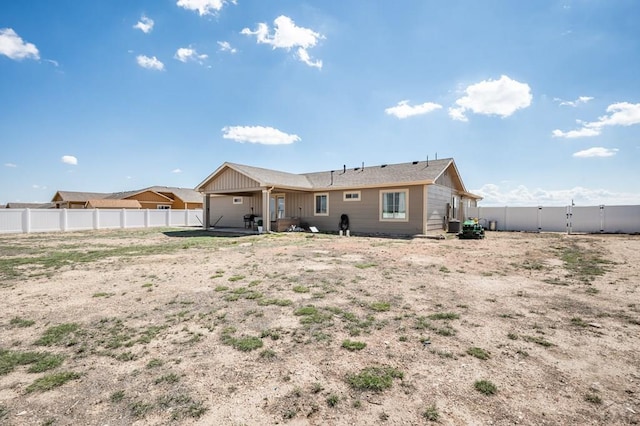 back of house featuring a fenced backyard and a patio