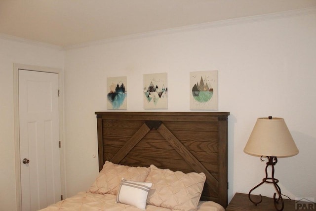 bedroom with ornamental molding