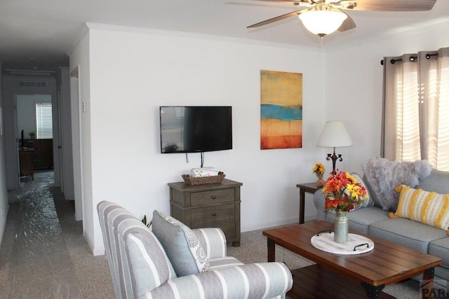 carpeted living room featuring visible vents, a ceiling fan, and crown molding