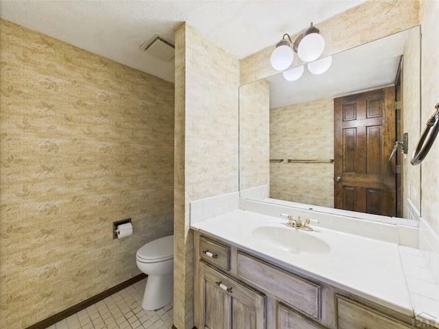 9 Woodsorrel Ct, Pueblo, CO 81001 - bathroom with toilet, vanity, tile patterned flooring, and baseboards