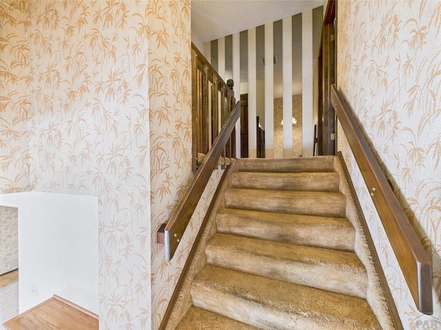 9 Woodsorrel Ct, Pueblo, CO 81001 - stairs featuring wallpapered walls