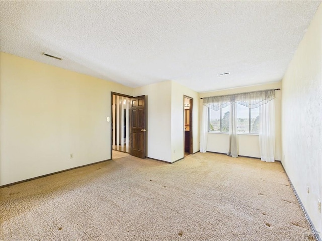 9 Woodsorrel Ct, Pueblo, CO 81001 - empty room with carpet floors, a textured ceiling, and baseboards