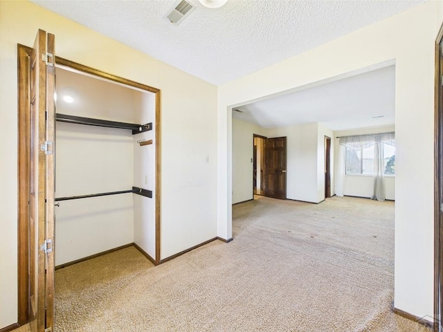 9 Woodsorrel Ct, Pueblo, CO 81001 - unfurnished bedroom with carpet, baseboards, and a textured ceiling