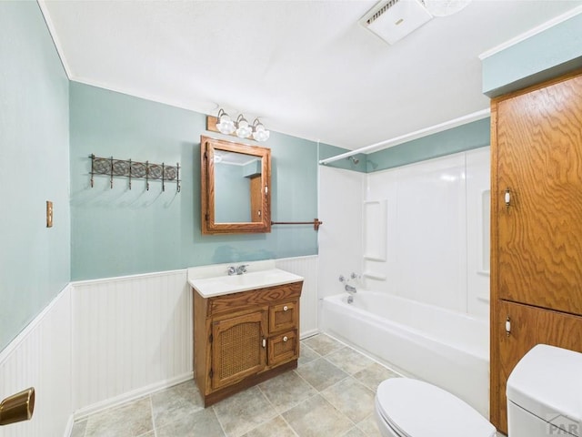 9 Woodsorrel Ct, Pueblo, CO 81001 - bathroom with toilet, a wainscoted wall,  shower combination, and vanity