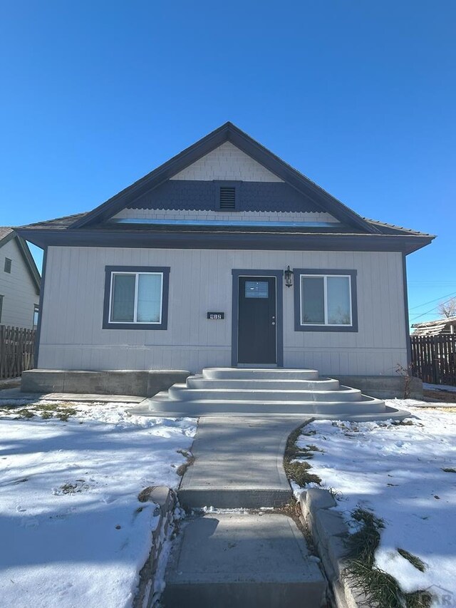 view of front of property featuring fence