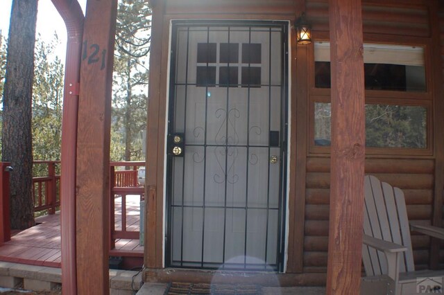 entrance to property with faux log siding