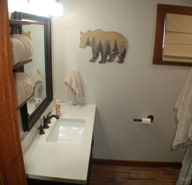 bathroom featuring vanity and baseboards