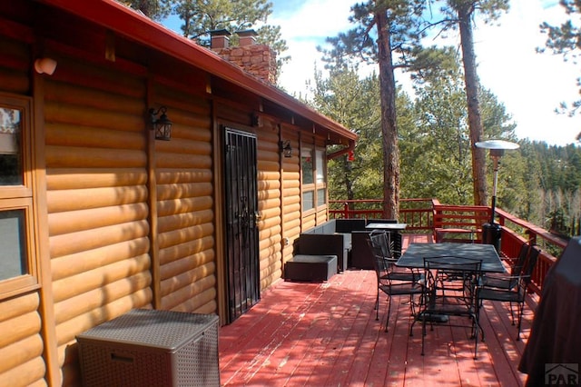 deck with outdoor dining space