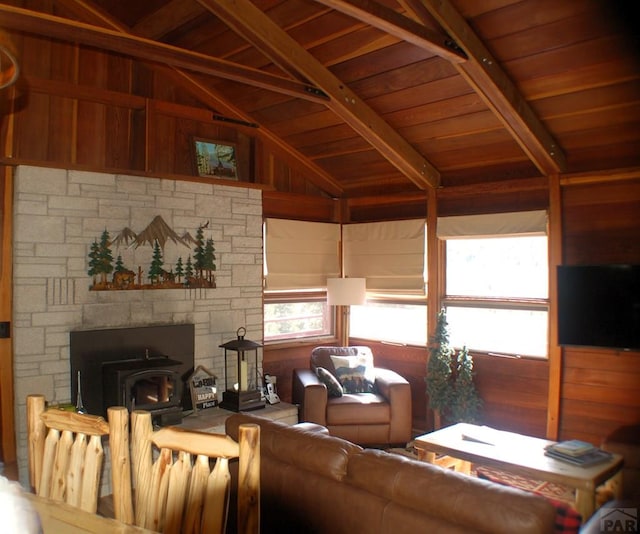 living room featuring lofted ceiling with beams and wooden ceiling