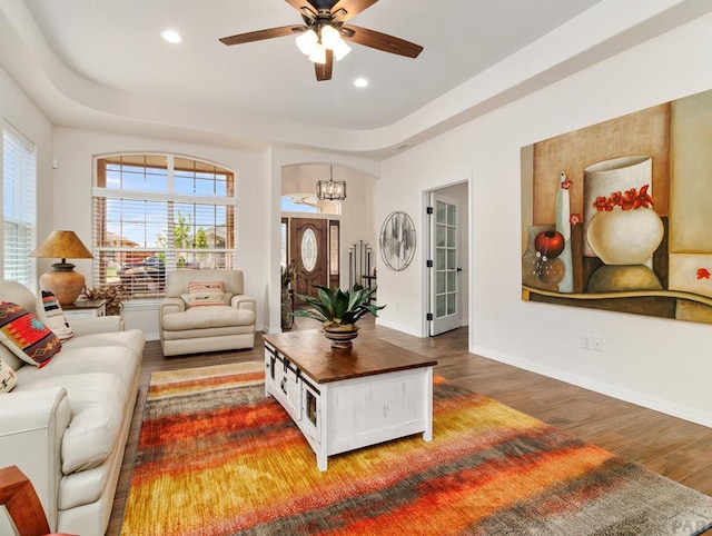 living area with recessed lighting, baseboards, and wood finished floors