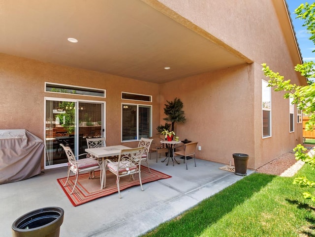 view of patio featuring outdoor dining area