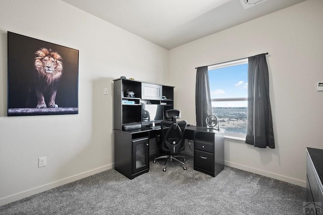 office space with carpet and baseboards