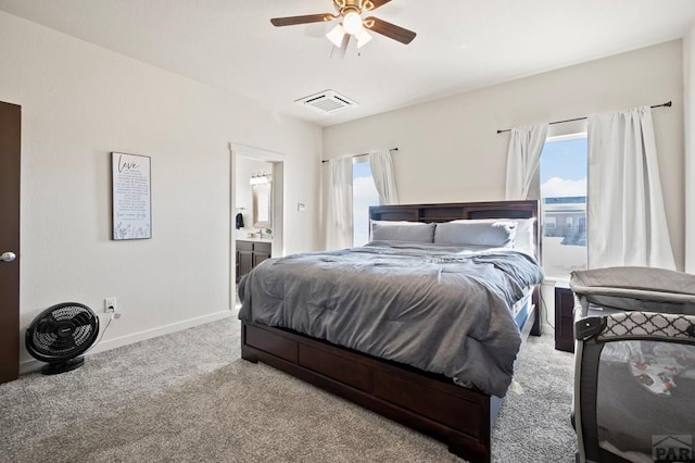 bedroom with carpet floors, multiple windows, visible vents, and baseboards