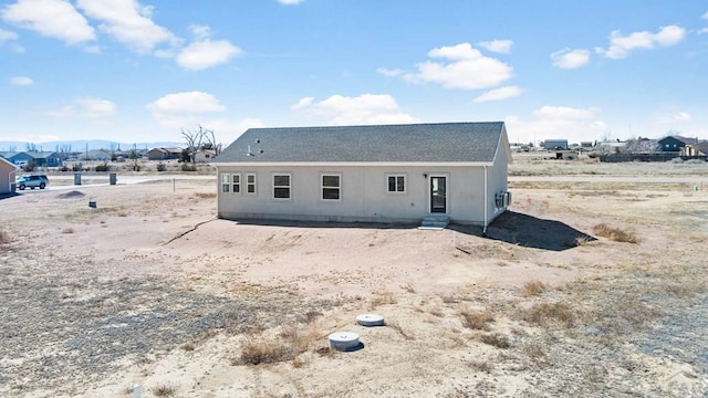 rear view of house with entry steps