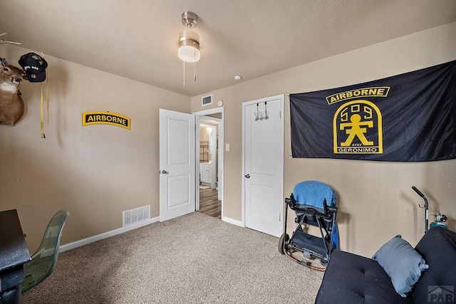 interior space with carpet flooring and baseboards