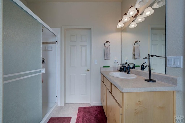 bathroom featuring a shower stall, tile patterned floors, and vanity