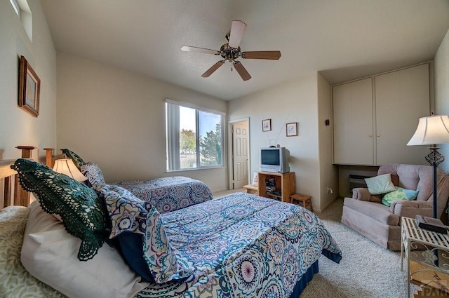 carpeted bedroom with a ceiling fan