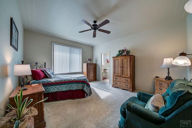 bedroom featuring a ceiling fan, light carpet, baseboards, and ornamental molding