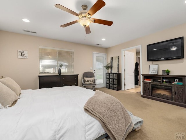 bedroom featuring light carpet, ceiling fan, visible vents, and recessed lighting