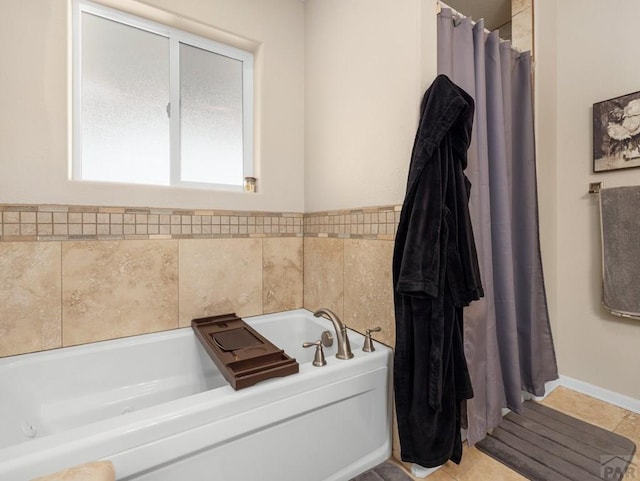 full bath featuring a garden tub and tile patterned floors