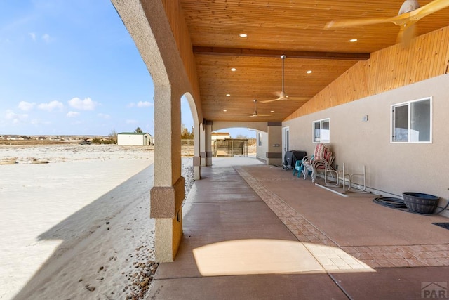 view of patio / terrace featuring fence and a ceiling fan