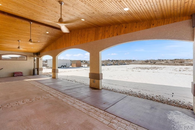 snow covered patio featuring a ceiling fan