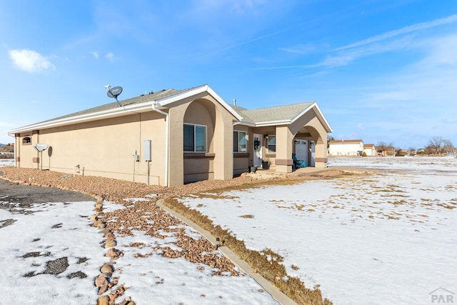 exterior space with stucco siding