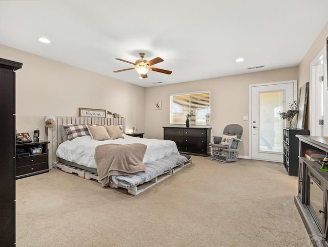 carpeted bedroom featuring a ceiling fan, recessed lighting, and visible vents