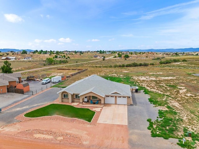 birds eye view of property featuring a mountain view