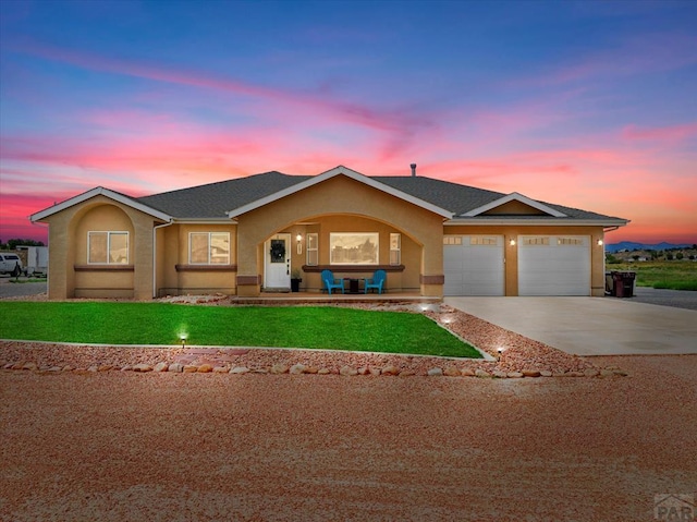 ranch-style house featuring a front lawn, a porch, concrete driveway, stucco siding, and an attached garage