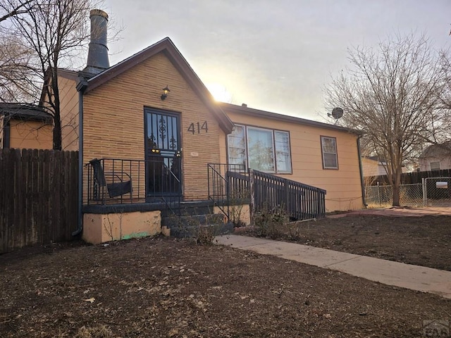 view of front of house with fence