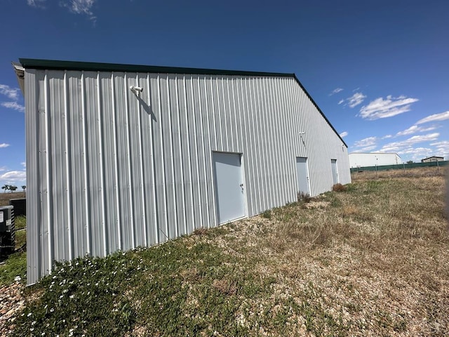 8681 Maverick Ln, Ordway, CO 81063 - view of pole building featuring a yard
